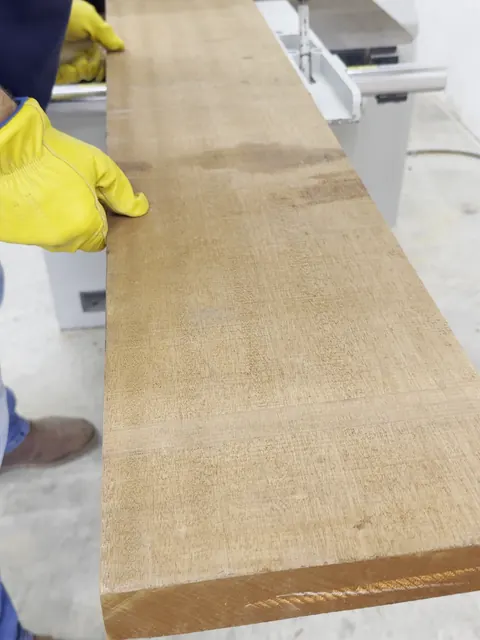 Carved clubhouse sign, feeding a mahogany board through the machine (Commercial)