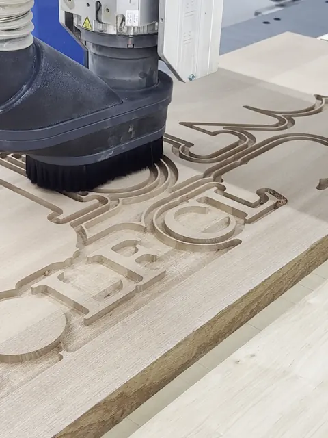 Carved clubhouse sign, CNC carving the lettering (Commercial)