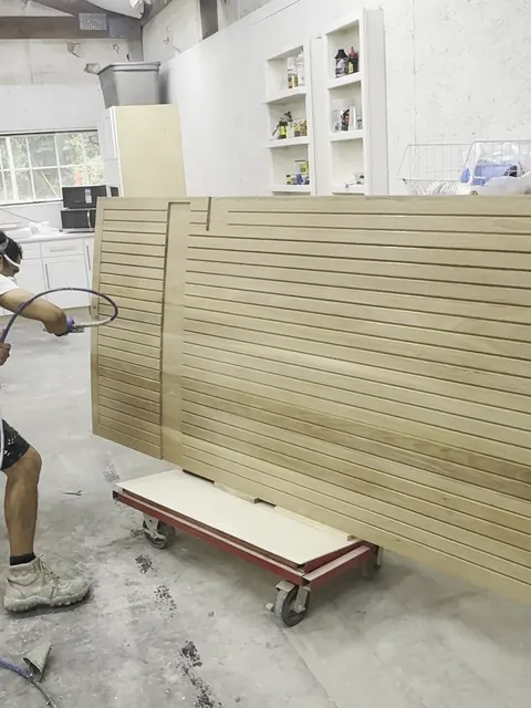 Oak slat wall & floating vanity, spraying the finish on the slat panels (Jimmy)