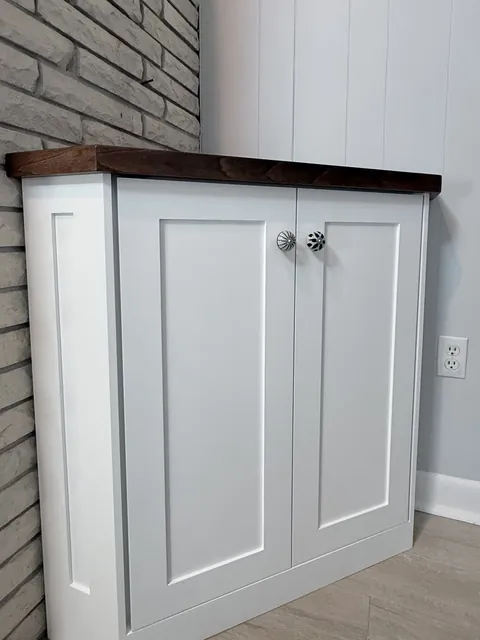 Walnut floating shelves and white shaker base cabinets