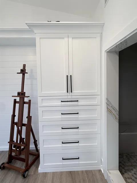 Studio built-ins & navy vanity, finished (Merry)