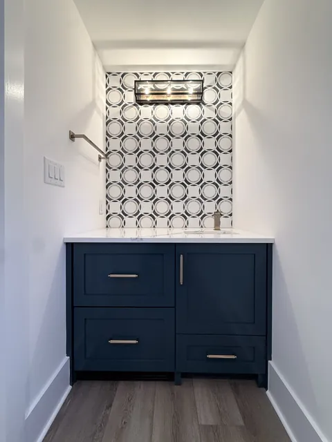 Studio built-ins & navy vanity, finished (Merry)