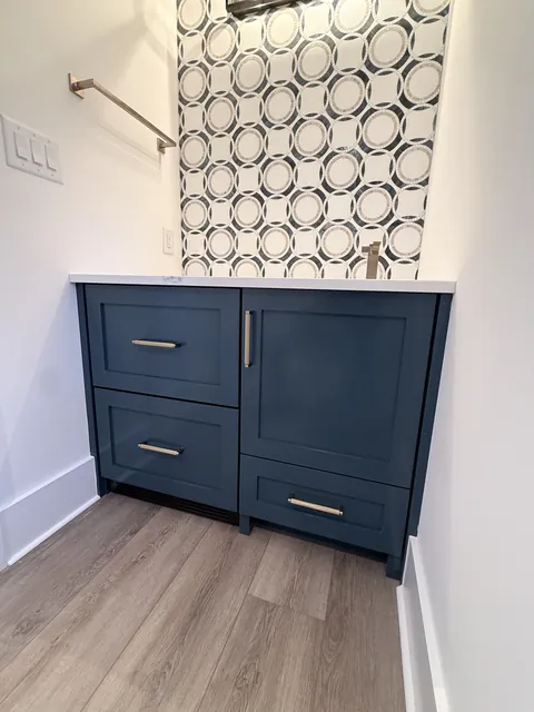 Studio built-ins & navy vanity, finished (Merry)