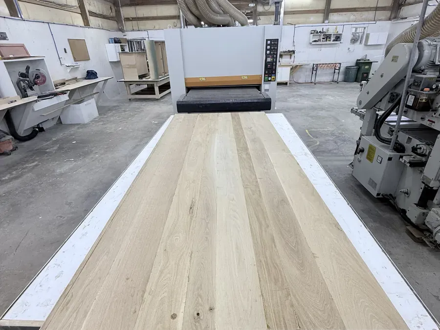 Ocean Bay Interiors wood shop with hardwood boards staged for in-house custom cabinetry work
